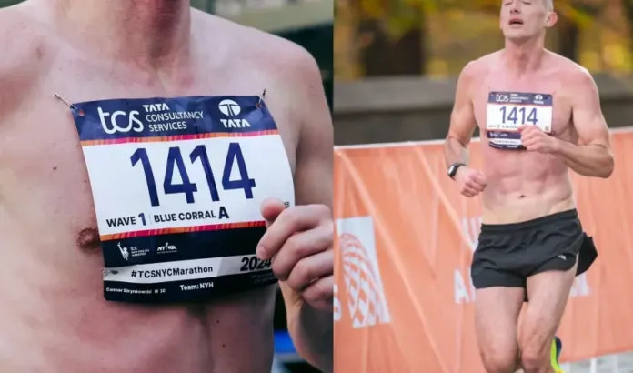 Connor Strynkowski corriendo el maratón sin camiseta y con el dorsal prendido en la piel